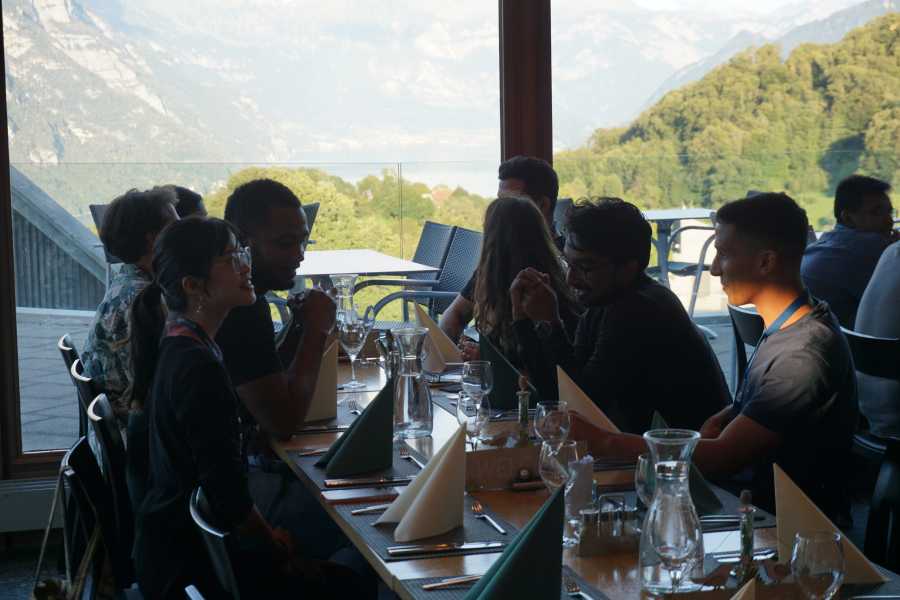 Participants dining and chatting together